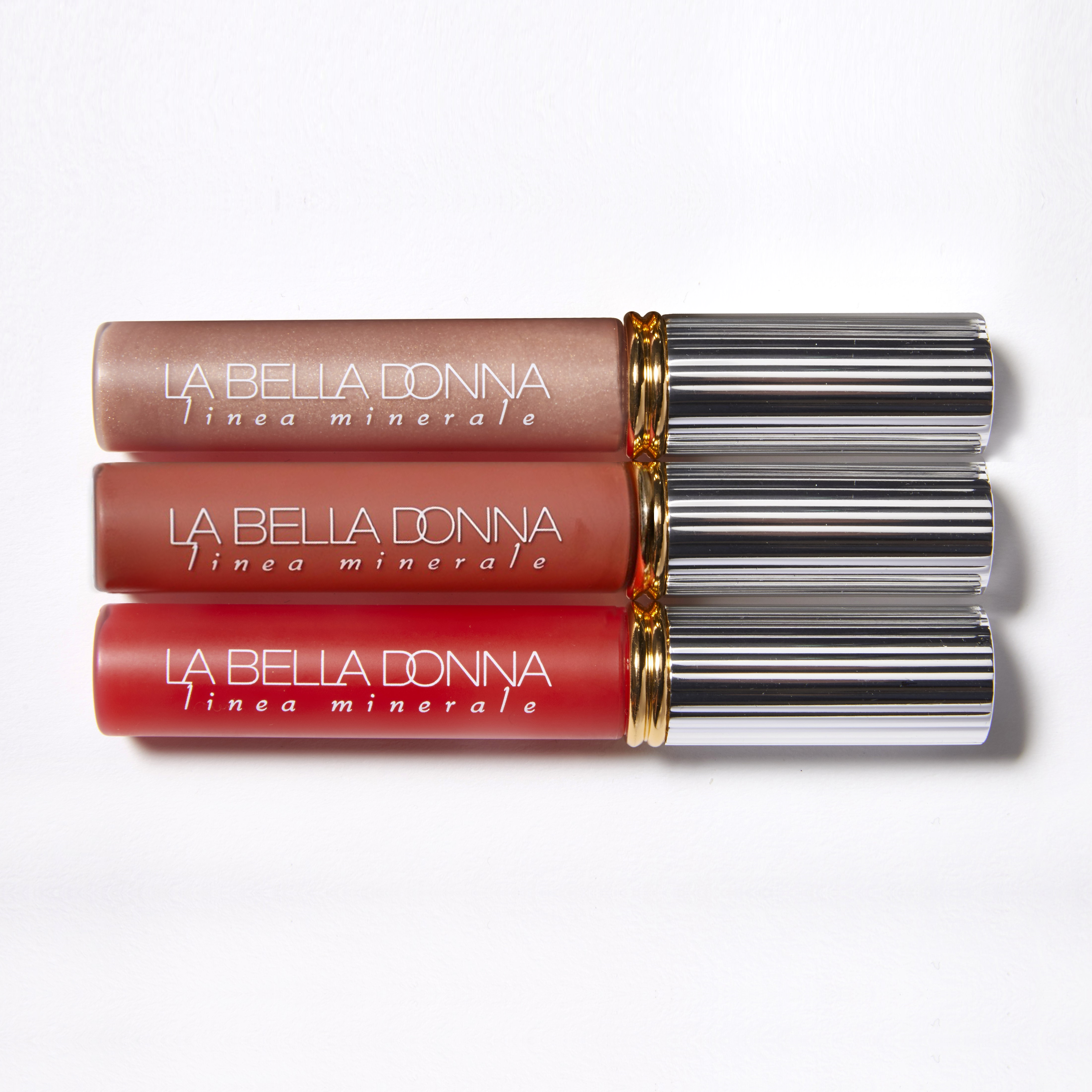 A light pink, medum nuide, and deep red lip gloss are shown together. The lighter pink is the color Oso and the deep red is Ma Cherie. The medium nude/neutral is Rose.