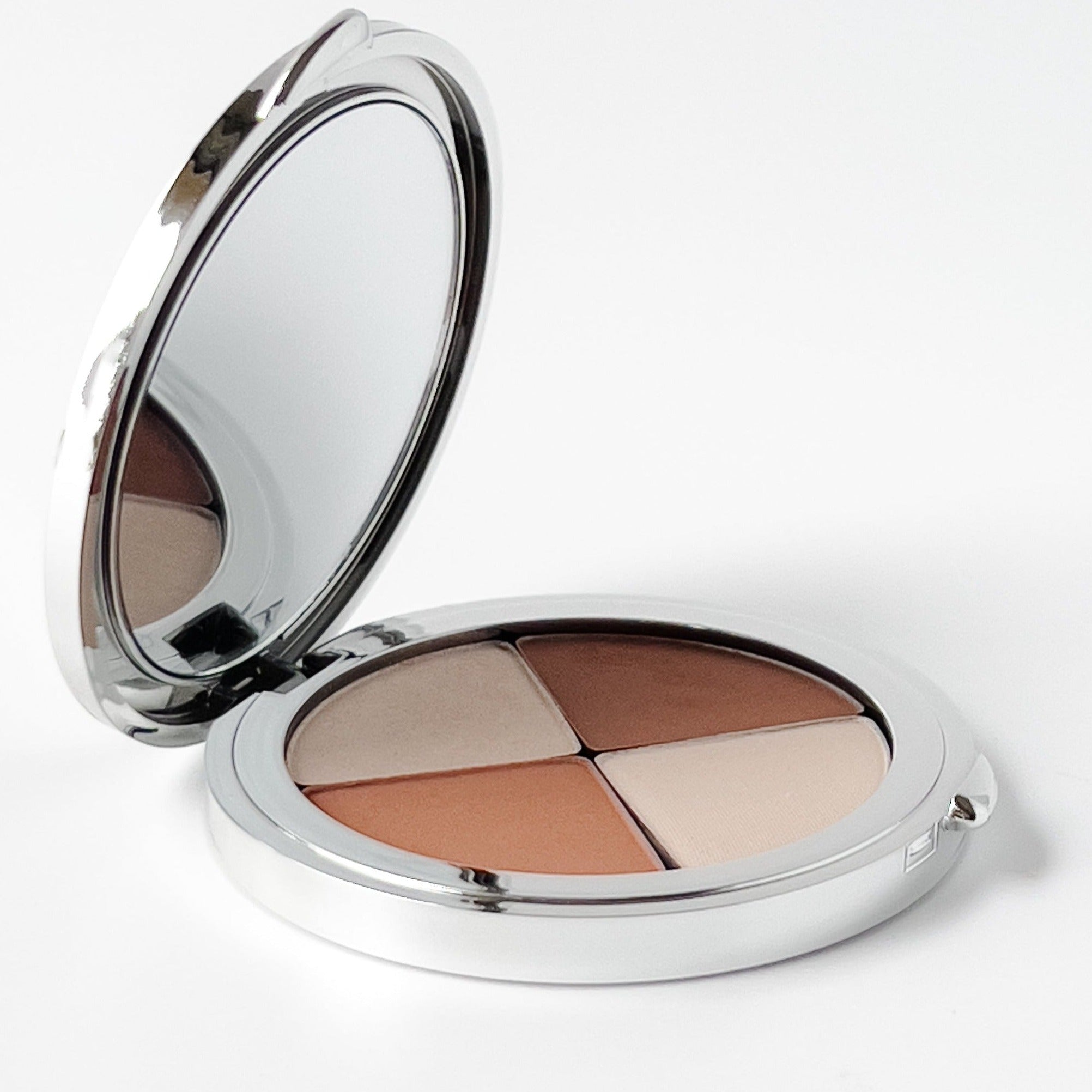 4 color, round compact palette shown from the side with a mirror and 4 triangles and shades of mineral makeup